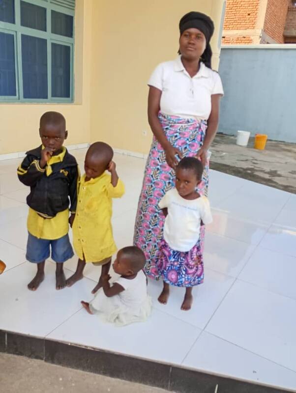 A TMDI team member with people supported by the foundation